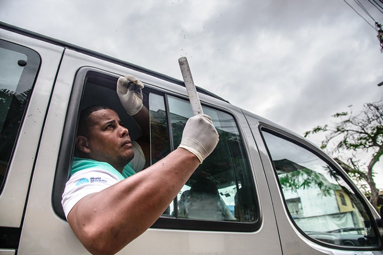 A WMP staff member releases Wolbachia mosquitoes in Niteroi, Rio de Janeiro