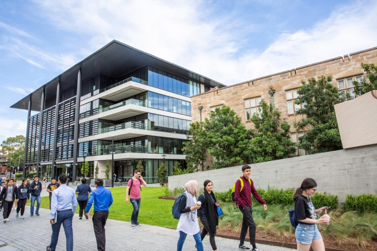 Students walk outside of the University of Sydney campus