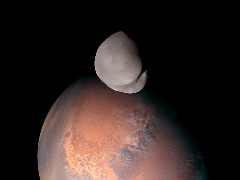 Hope observes Deimos above Mars during close fly-by.