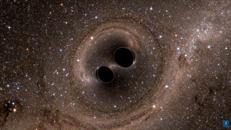 The collision of two black holes holes is seen in this still from a computer simulation.