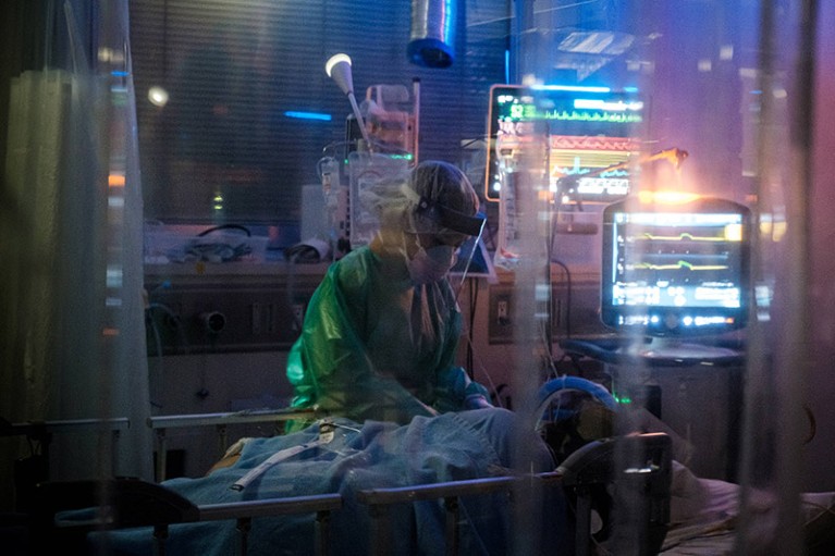 A medical worker takes care of a Covid-19 coronavirus patient on a mechanical ventilator in Japan.