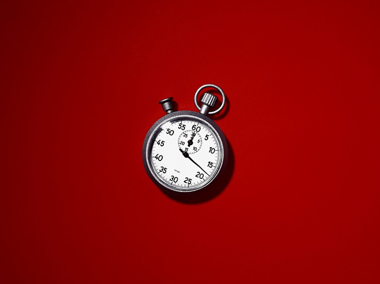 Stopwatch on red background.