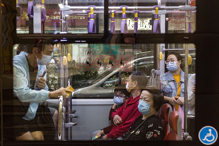 Passengers wearing masks on a bus in Macao, China.