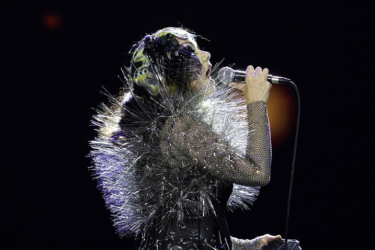 Bjork singing into a microphone at the 2023 Coachella Valley Music And Arts Festival on April 16, 2023 in Indio, California.