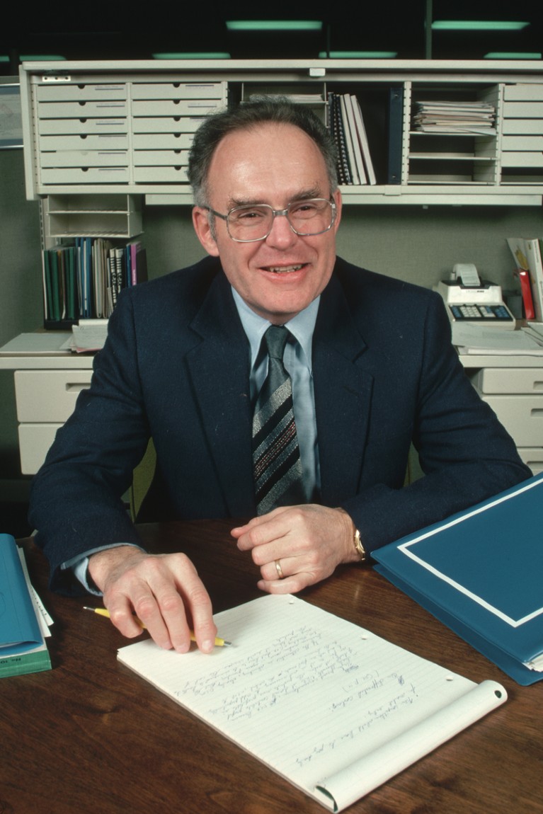 Portrait of Gordon Moore writing on a notepad