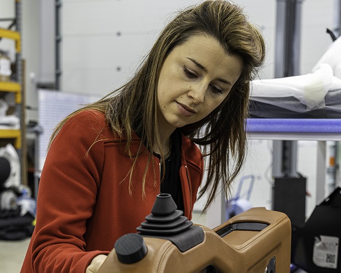 Imogen Howarth, Director of Specifications at Singer Vehicle Design, working on car designs.