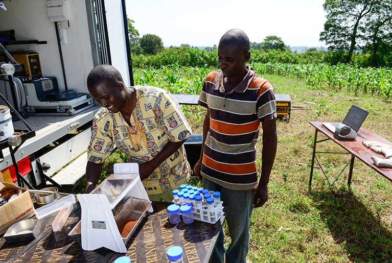 Researchers at work at a mobile soil testing lab in Mabanga, Kenya.