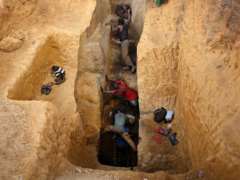 Men ascend from a pit in a cobalt mine, Congo, DRC.