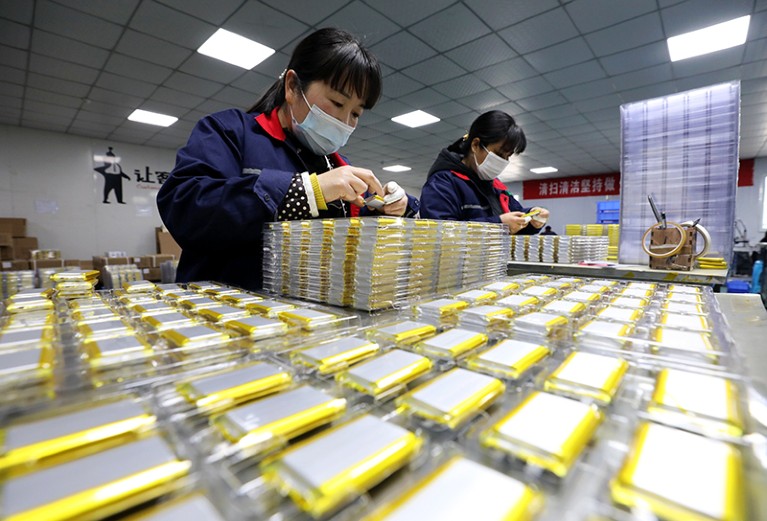 Employees work at a lithium-ion battery manufacturing plant in Huaibei, Anhui Province of China.