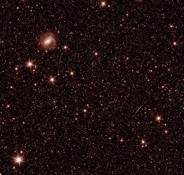 Image showing tons of glimmering spots representing stars and galaxies taken by Euclid's VIS instrument