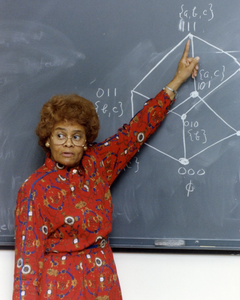 Evelyn Boyd Granville teaching at a blackboard in 1991