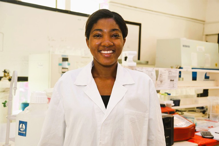 Pearl Akazue in a white lab coat at her laboratory.