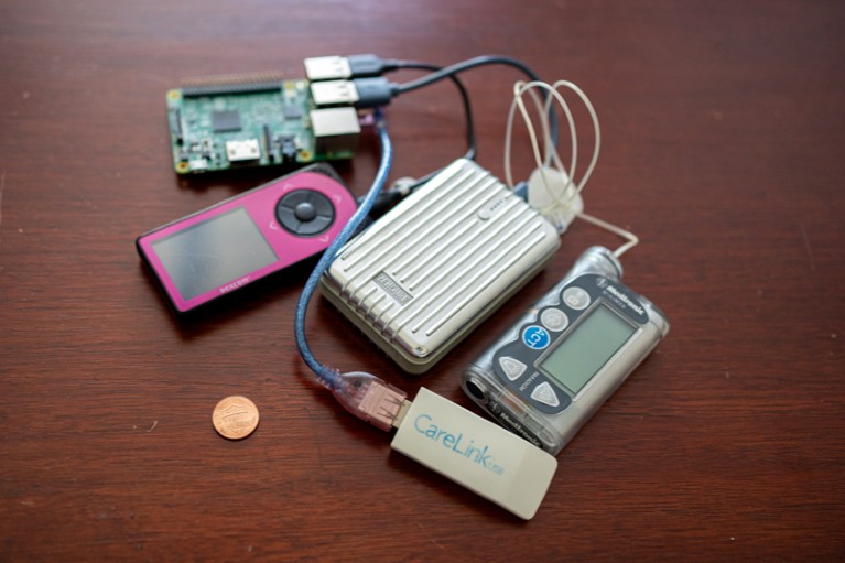 Close-up of a DIY rig on a wooden table with a one cent coin for scale