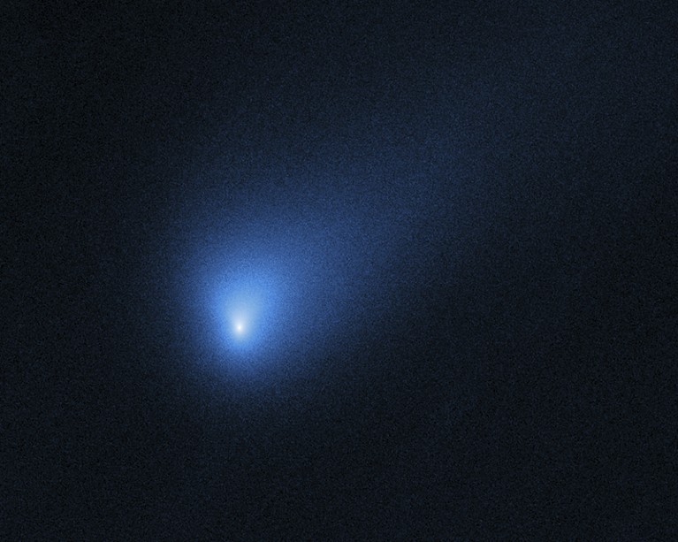 NASA's Hubble Space Telescope captured comet 2I/Borisov as a blue glow in dark space.