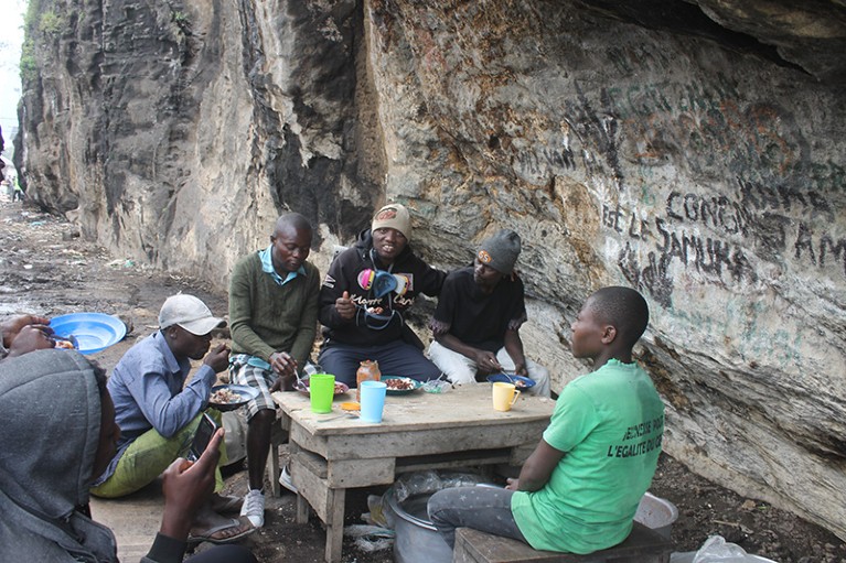 Four days after the Nyiragongo eruption Charles Balagizi was in the region, and here he eats lunch with others.