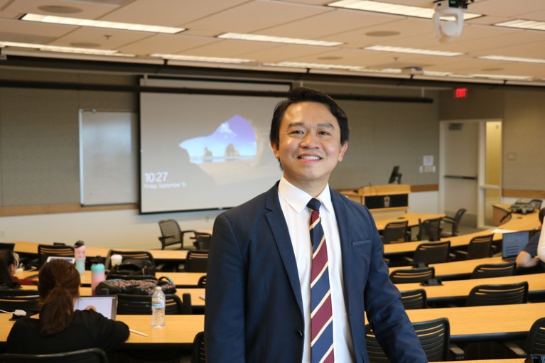 Portrait of Ike de la Peña in a lecture room