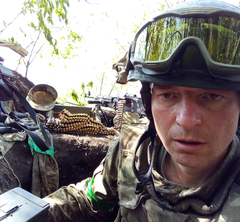 Sergiy Sylantyev pictured at a machine gun emplacement while on deployment during the war.