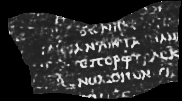 Scan showing a fragment of papyrus in black, with Greek letters visible in white.