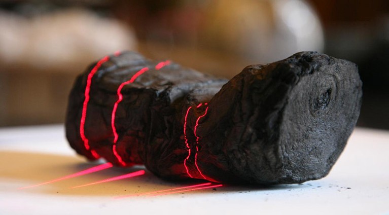 A burnt and carbonized scroll undergoing a scan.