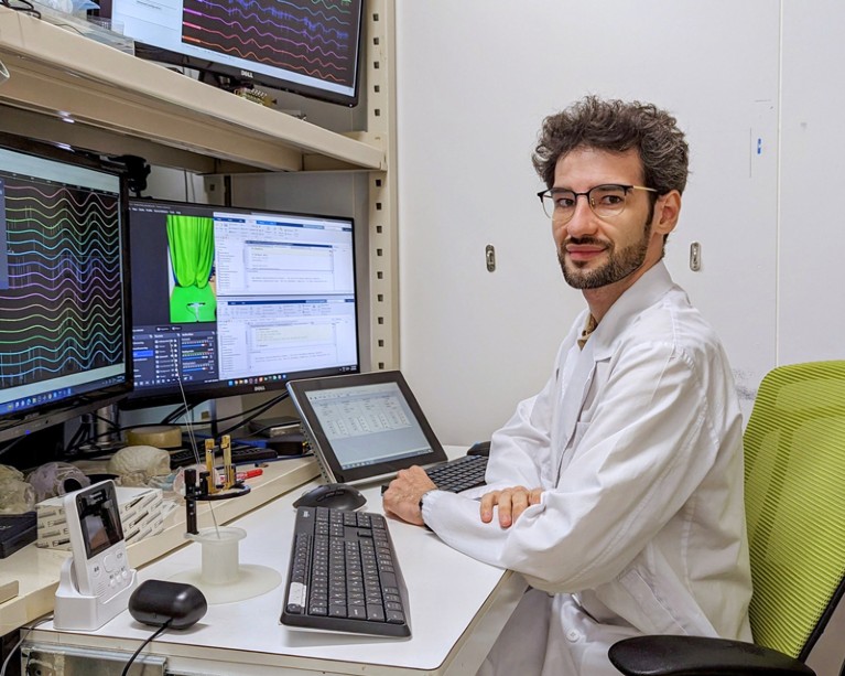 Rafael Bretas Vieira working at his desk