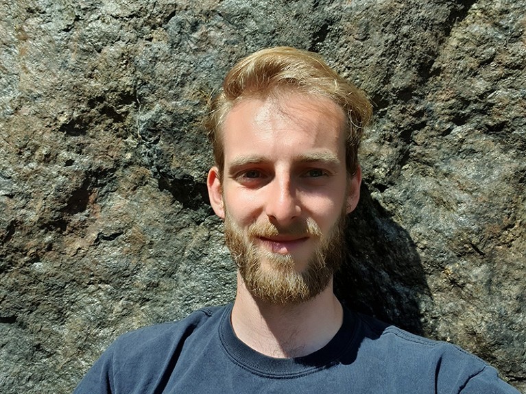 Portrait of Lars Borm in front of a rock surface.