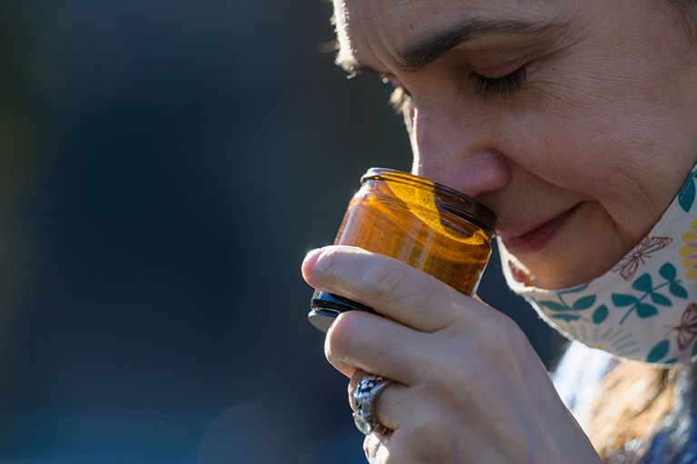 Leah Holzel smells aromatic spices as part of her coaching for people who lost their sense of smell due to Covid-19.