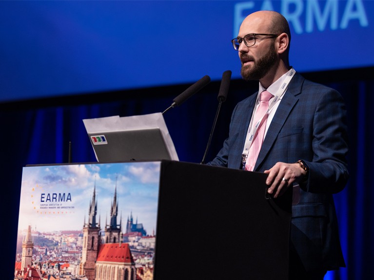 Nik Claesen at lectern.