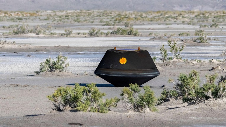 The scorched re-entry capsule the NASA OSIRIS-REx mission after landing at the Utah Test and Training Range.