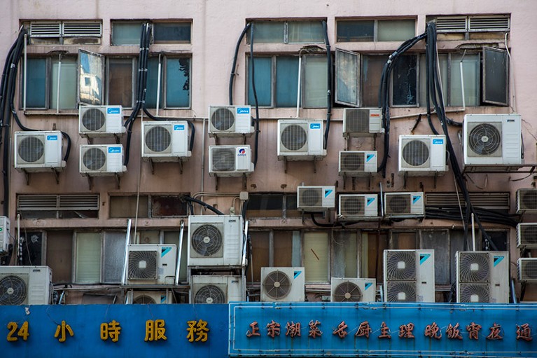 Wall mounted air conditioning units behind a building in Hong Kong.