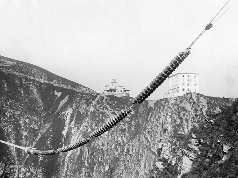 High voltage experiments with bolts on the Monte Generoso, in the background the hotel Kulm and the summit station, 1928.