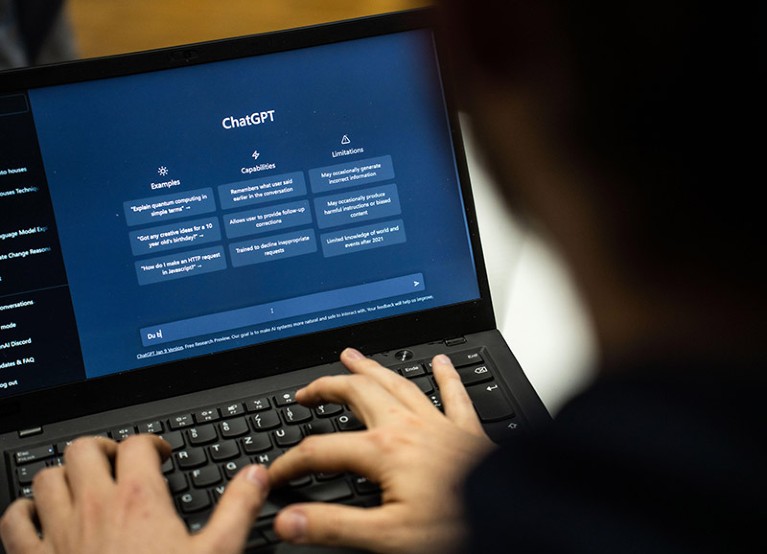 A person using ChatGPT on a laptop computer.