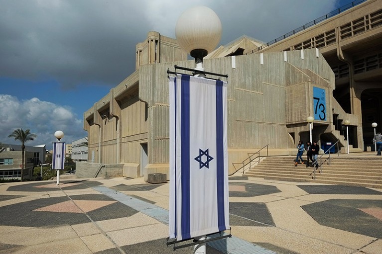 Israeli flags hanged outside the humanities and social sciences building on the Ben-Gurion University of the Negev campus in southern Israel.