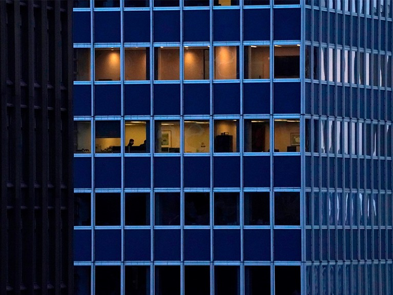 Employees work in an office building in Midtown New York City.