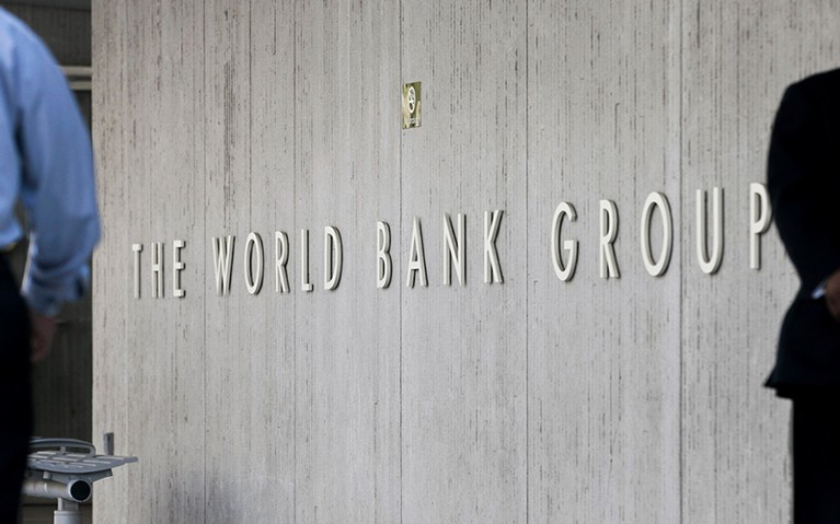 People walk past the headquarters of the World Bank in Washington, D.C., U.S.