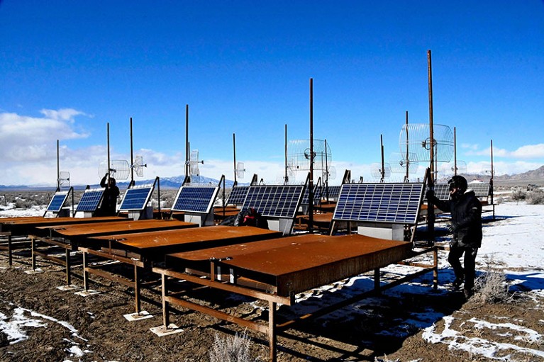 Researchers check the Telescope Array surface detector in the high desert in Delta, Utah, USA.