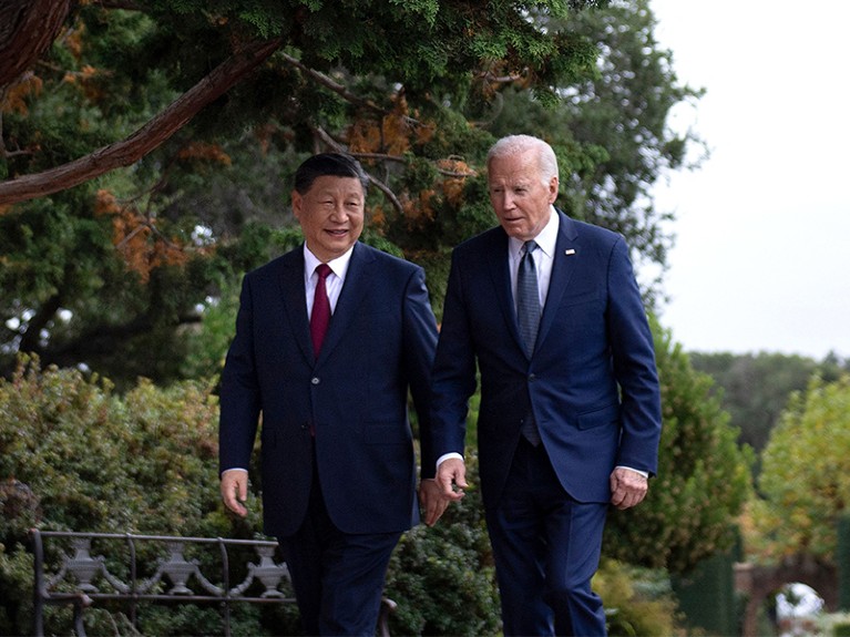 Joe Biden and Xi Jinping walk together after a meeting during the Asia-Pacific Economic Cooperation Leaders' week in Woodside, California