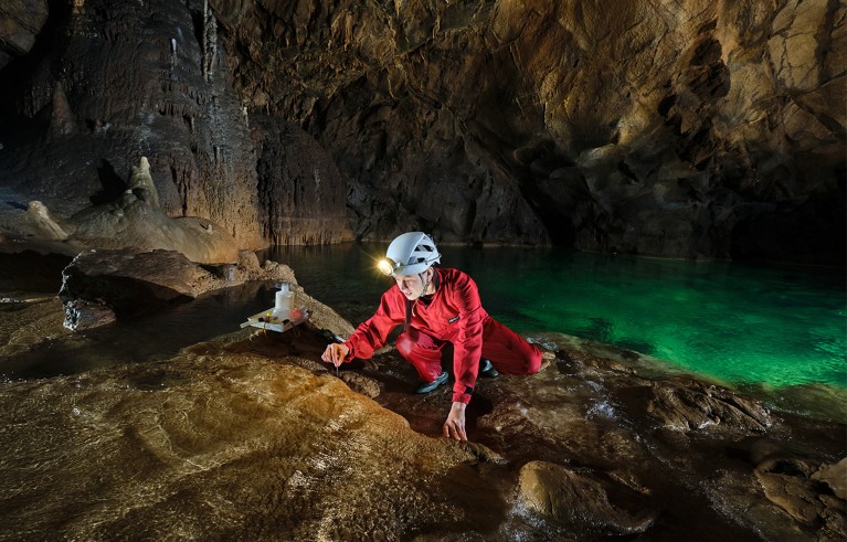Spela Borko during sampling in one of the cave she is carrying on research, Slovenia.