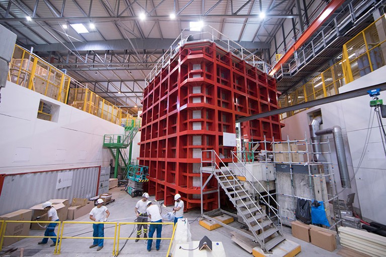 Workers make progress on the enormous ProtoDUNE detector at CERN, one of two huge testbeds for the Fermilab-hosted Deep Underground Neutrino Experiment.