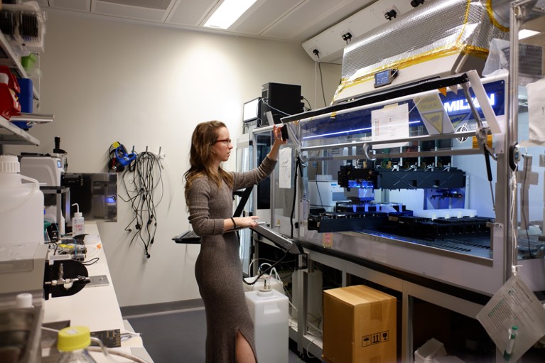 Erika DeBenedictis works with equipment in the lab