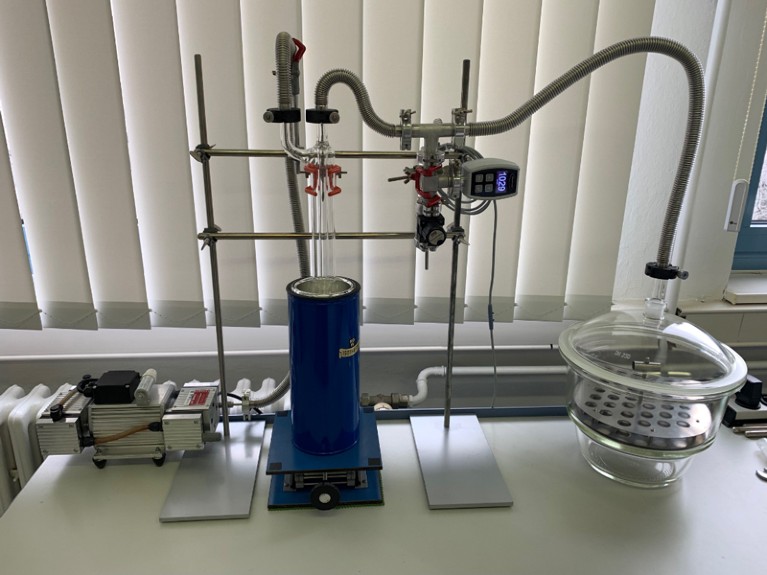 A low-pressure evaporation system is seen on a desk in front of a window