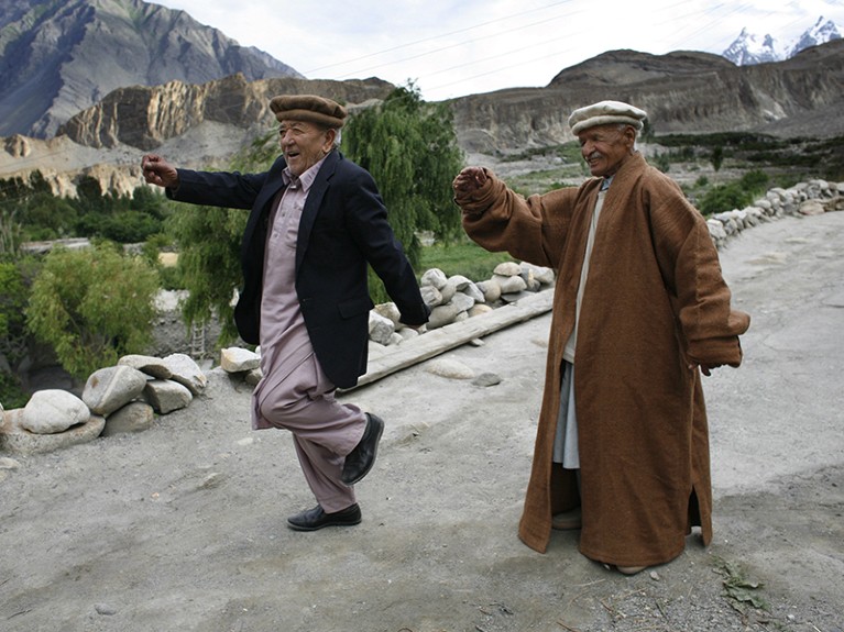 Mohammed Gulman, 97 years old, practices a traditional dance with old friend Haider Kahn, age 92, for an upcoming festival July 4, 2007 in Passu, Upper Hunza Valley, Pakistan.