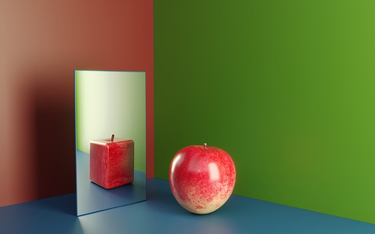 An apple in a mirror reflecting cube shaped version of himself. Surreal cube shaped apple reflection of a red apple.