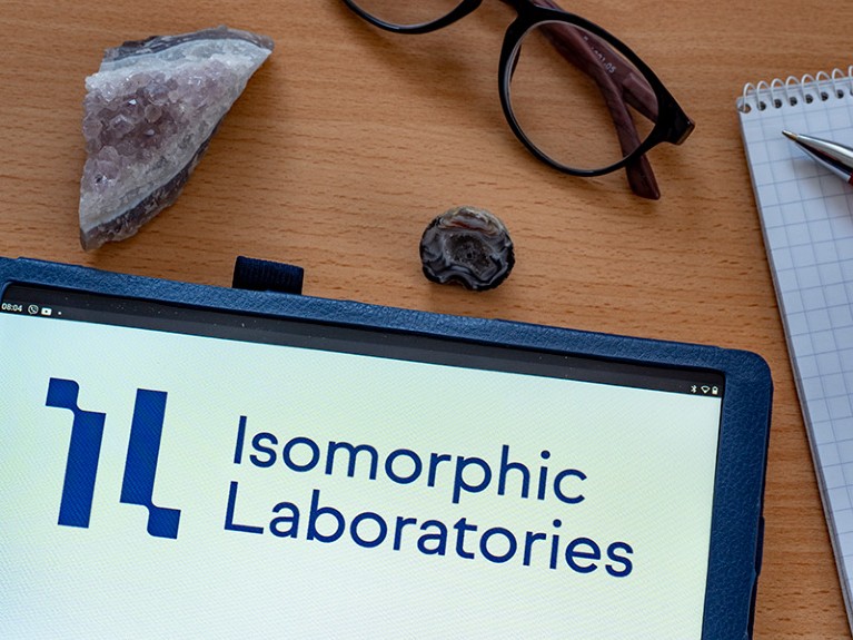 Ilustração fotográfica do logotipo da Isommorphic Labs exibido em um tablet.