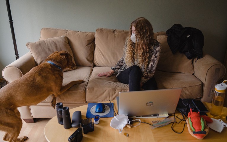 Judy Schafer who suffers from long covid symptoms pictured with her dog at her home in Seattle.