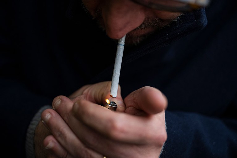 Close up of a man as he smokes a cigarette in Sundbyberg, near Stockholm.