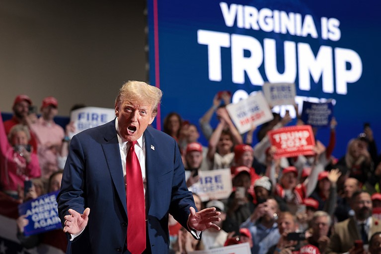 Republican presidential candidate and former President Donald Trump reacts to supporters as he arrives on stage at a Get Out the Vote Rally March 2, 2024 in Richmond, Virginia.