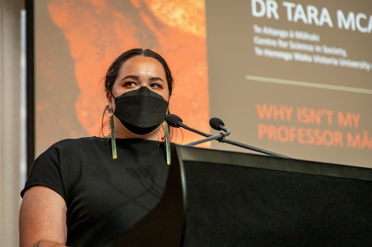 Portrait of Tara McAllister wearing a black face mask