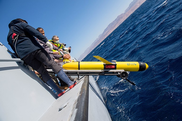 lower a Slocum Glider unmanned undersea vehicle into the Gulf of Aqaba during International Maritime Exercise/Cutlass Express 2022.