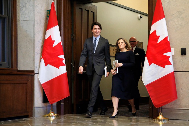 Justin Trudeau, Canada's prime minister, left, and Chrystia Freeland, Canada's deputy prime minister and finance minister, hold copies of the federal budget in Ottawa, Ontario, Canada.
