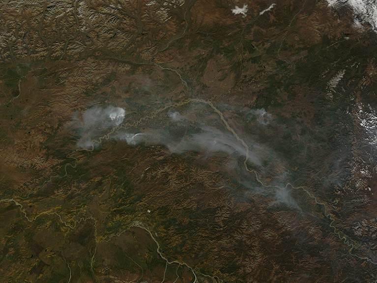 Smoke billows from three small fires burning in the autumn landscape around the Yukon River in this true-color image from September 15, 2010.